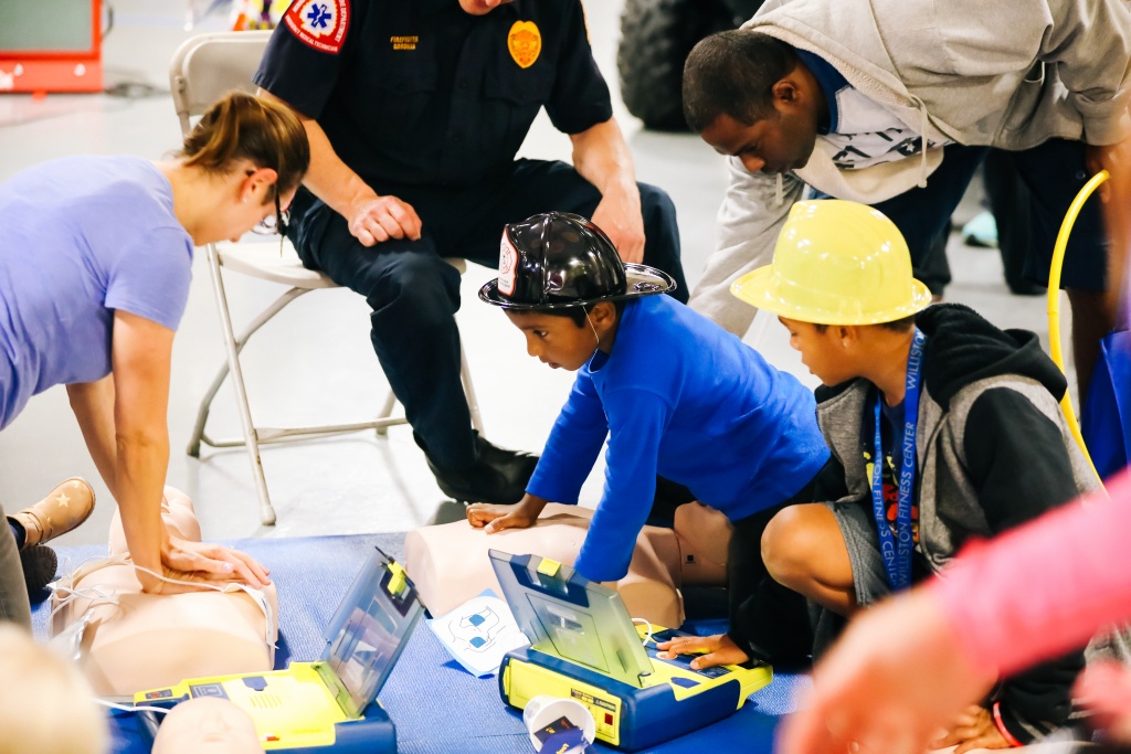 Children learning CPR