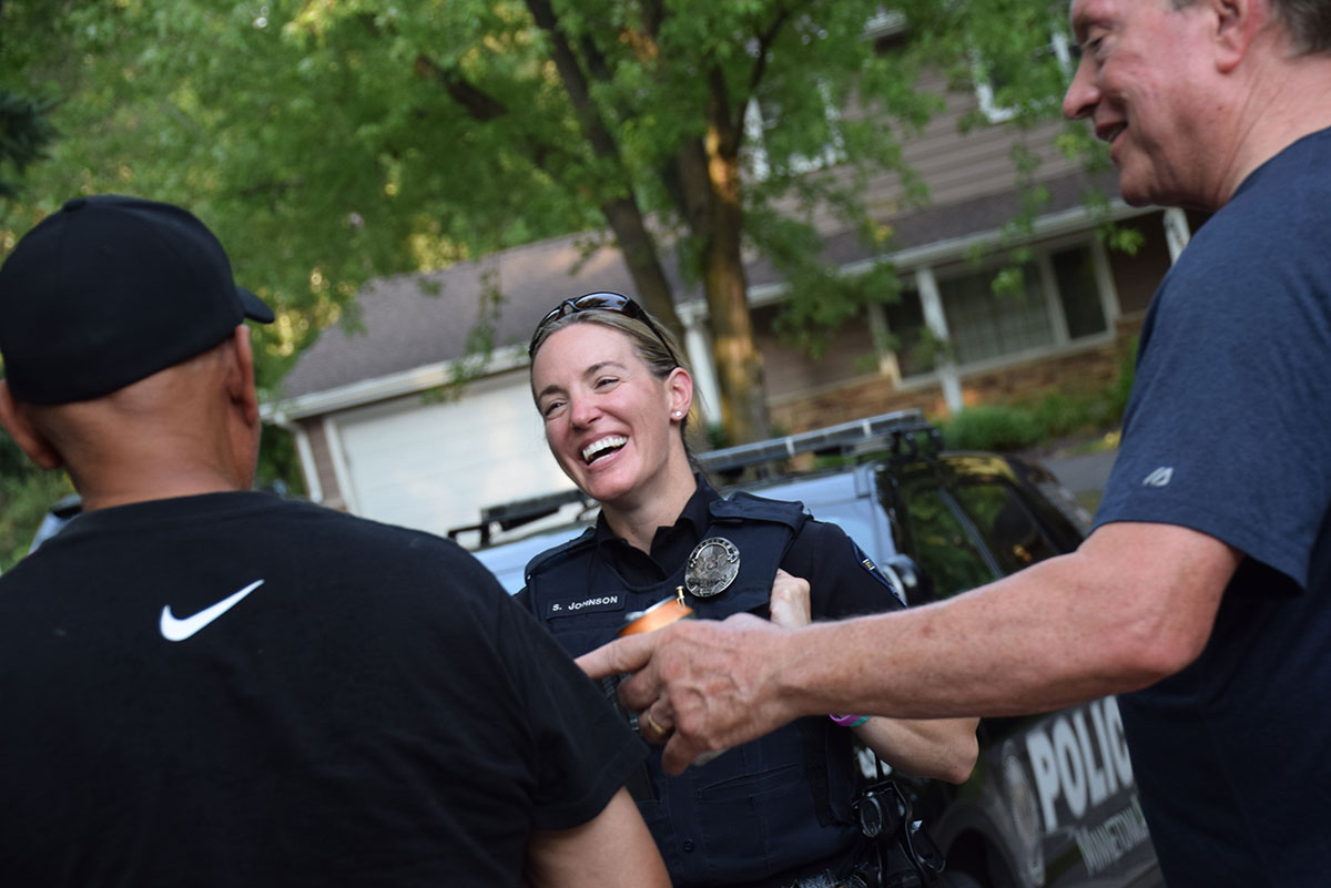 Officer smiling and talking with residents