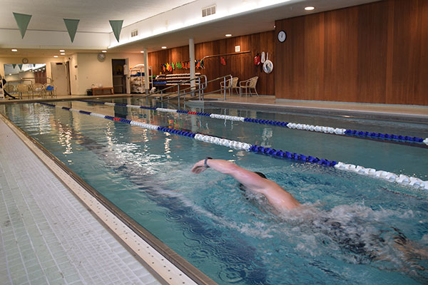 Person swimming in pool