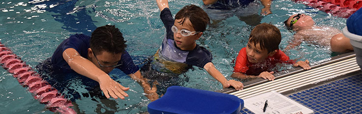 Teen with kids on side of pool