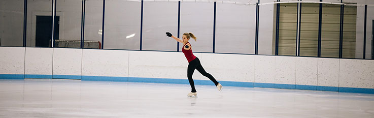 Lone woman skating on the ice