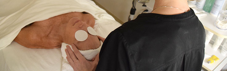 Woman getting facial on table