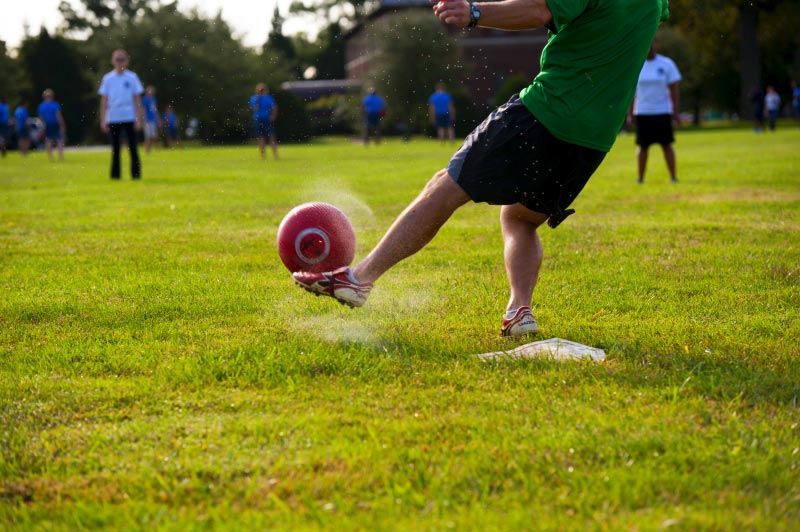 person kicking ball