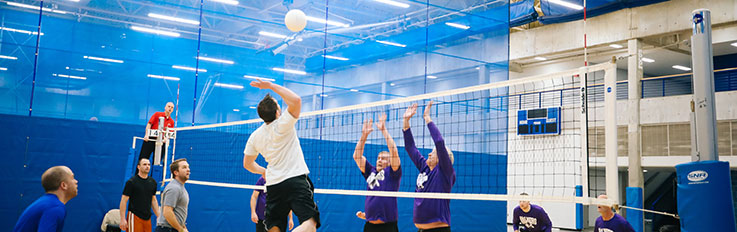 Men playing volleyball