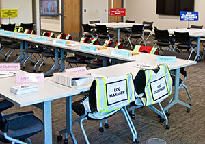 Room set up with chairs and signage